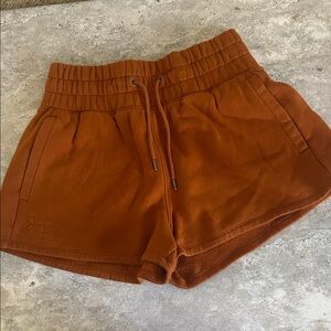 Under Armour women’s shorts size medium. Rust color